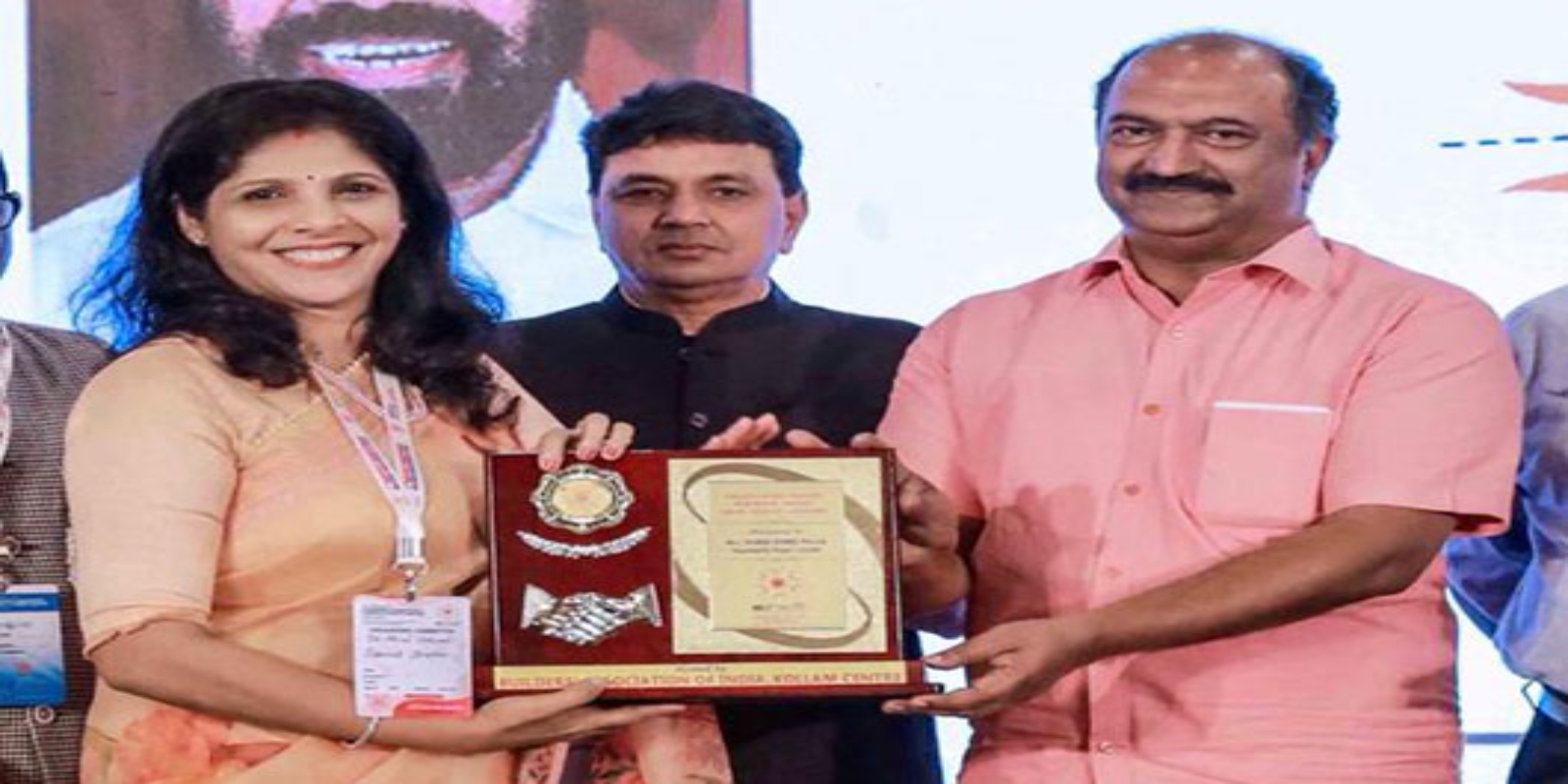 Receiving the Best Builder Award 2022 from Builders Association of India