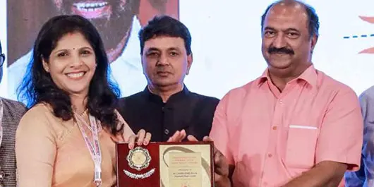 Receiving the Best Builder Award 2022 from Builders Association of India